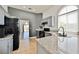 Kitchen with gray cabinets and granite counters plus stainless appliances at 10404 Shadowland Ave, Las Vegas, NV 89144