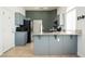 Kitchen with gray cabinets and granite counters plus stainless appliances at 10404 Shadowland Ave, Las Vegas, NV 89144