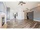 Open-concept living area with a fireplace, stylish flooring, and lots of natural light at 10404 Shadowland Ave, Las Vegas, NV 89144