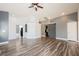 Inviting living room with modern flooring, neutral walls, and convenient access to other rooms at 10404 Shadowland Ave, Las Vegas, NV 89144