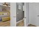 Half bath features modern fixtures and light wood-look tile flooring at 11249 Revelry Ln, Las Vegas, NV 89138