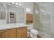 Modern bathroom featuring a glass-enclosed shower and sleek vanity with a bright light at 11249 Revelry Ln, Las Vegas, NV 89138