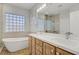 Bright and modern bathroom featuring a separate shower, bathtub, and double sink vanity at 11249 Revelry Ln, Las Vegas, NV 89138