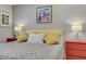 This bedroom boasts a comfortable bed and colorful artwork enhancing the room's appeal at 11249 Revelry Ln, Las Vegas, NV 89138