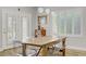 Bright dining room featuring modern light fixtures, and transparent chairs at 11249 Revelry Ln, Las Vegas, NV 89138