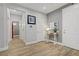 Inviting entryway with wood-look tile flooring, a console table, and access to other rooms at 11249 Revelry Ln, Las Vegas, NV 89138