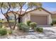 Charming single-story home featuring a well-maintained front yard and two-car garage at 11249 Revelry Ln, Las Vegas, NV 89138