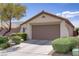 Charming single-story home with a well-maintained front yard and an attached two-car garage at 11249 Revelry Ln, Las Vegas, NV 89138