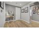 Welcoming foyer with light gray walls, wood-look tile flooring, and decorative accents at 11249 Revelry Ln, Las Vegas, NV 89138