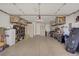 Spacious garage with ample storage solutions, including shelving and overhead racks at 11249 Revelry Ln, Las Vegas, NV 89138