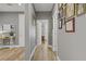 Inviting hallway featuring hardwood floors and decorative wall art at 11249 Revelry Ln, Las Vegas, NV 89138