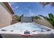 Exterior view of a well-maintained hot tub surrounded by desert landscaping at 11249 Revelry Ln, Las Vegas, NV 89138