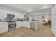 Spacious kitchen with stainless steel appliances and a view into the open-plan living area at 11249 Revelry Ln, Las Vegas, NV 89138