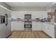 Bright kitchen with a stainless steel oven, white cabinetry, and backsplash at 11249 Revelry Ln, Las Vegas, NV 89138