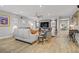 Inviting living room with wood look flooring, stylish decor, and a comfortable seating area at 11249 Revelry Ln, Las Vegas, NV 89138
