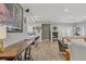 Open concept living room and dining area with modern furniture and natural light at 11249 Revelry Ln, Las Vegas, NV 89138