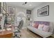Comfortable office space with wood floors, a desk, and a daybed for relaxation at 11249 Revelry Ln, Las Vegas, NV 89138