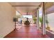Relaxing covered patio with ceiling fan, outdoor dining set and lounge chairs at 11249 Revelry Ln, Las Vegas, NV 89138