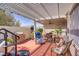 Outdoor patio features covered seating area, grill, and string lights at 11249 Revelry Ln, Las Vegas, NV 89138