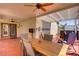 Back patio with outdoor seating, dining table, and a view of the hot tub at 11249 Revelry Ln, Las Vegas, NV 89138