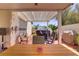 Outdoor patio featuring a covered dining area, lounge seating and a hot tub at 11249 Revelry Ln, Las Vegas, NV 89138
