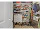 Walk-in closet featuring custom shelving, drawers and cabinets for storage at 11249 Revelry Ln, Las Vegas, NV 89138