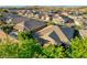 A beautiful aerial view of a home with a private pool in a well-maintained, quiet neighborhood with mature landscaping at 1153 Mesa Verde Run, Mesquite, NV 89027