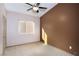 Neutral bedroom with standard ceiling fan and window at 1153 Mesa Verde Run, Mesquite, NV 89027