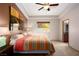 Spacious bedroom features tray ceilings, a colorful bedspread, and warm paint at 1153 Mesa Verde Run, Mesquite, NV 89027