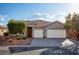 Charming single-story home featuring a three-car garage and beautifully landscaped front yard at 1153 Mesa Verde Run, Mesquite, NV 89027