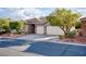 Charming single-Gathering home boasts a well-manicured lawn, a spacious driveway, and a convenient two-car garage at 1153 Mesa Verde Run, Mesquite, NV 89027