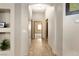 Hallway features neutral walls and floors leading to rooms with paneled doors at 1153 Mesa Verde Run, Mesquite, NV 89027