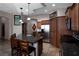 Modern kitchen with stainless steel appliances, granite countertops, and a breakfast bar with seating at 1153 Mesa Verde Run, Mesquite, NV 89027