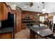 Stylish kitchen featuring granite countertops, stainless steel appliances, and a breakfast bar at 1153 Mesa Verde Run, Mesquite, NV 89027