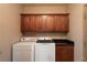Laundry room with washer, dryer, and upper and lower cabinets at 1153 Mesa Verde Run, Mesquite, NV 89027