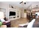 Open-concept living room showcasing a built-in entertainment center and seamless flow to the kitchen at 1153 Mesa Verde Run, Mesquite, NV 89027