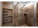 Tiled shower with glass door and closet with shelving at 1153 Mesa Verde Run, Mesquite, NV 89027