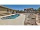 Landscaped backyard featuring an inground pool with a concrete surround at 1197 Bear Head St, Henderson, NV 89011