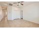 Spacious bedroom featuring tile flooring, closet, and a ceiling fan for added comfort at 1197 Bear Head St, Henderson, NV 89011