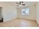 Bright and airy bedroom with a ceiling fan and tile flooring, offering a serene retreat at 1197 Bear Head St, Henderson, NV 89011