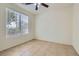 Bright bedroom featuring tile flooring and a large window that lets in natural light at 1197 Bear Head St, Henderson, NV 89011