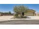 Charming single-story home with a well-maintained yard, two car garage and desert landscaping at 1197 Bear Head St, Henderson, NV 89011