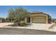 Charming single-story home with a well-maintained yard, two car garage and desert landscaping at 1197 Bear Head St, Henderson, NV 89011