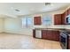 Well-appointed kitchen with stainless steel appliances, tile floors, and lots of counter space at 1197 Bear Head St, Henderson, NV 89011