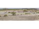 Desert landscape with a road and distant mountains at 1197 Bear Head St, Henderson, NV 89011