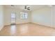 Open living room with a ceiling fan and door to backyard at 1197 Bear Head St, Henderson, NV 89011