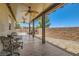 Covered patio with ceiling fans and a view of the landscaped backyard at 1197 Bear Head St, Henderson, NV 89011
