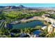 Aerial view showcases a beautiful lakefront community with lush golf course and serene lake at 12 Via Ravello, Henderson, NV 89011