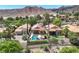 Enjoy this aerial view of the home, showcasing the pool, mountain views, and landscaping in the community at 12 Via Ravello, Henderson, NV 89011