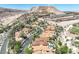 Panoramic aerial view of a luxurious community with mountain views, and lush landscaping at 12 Via Ravello, Henderson, NV 89011